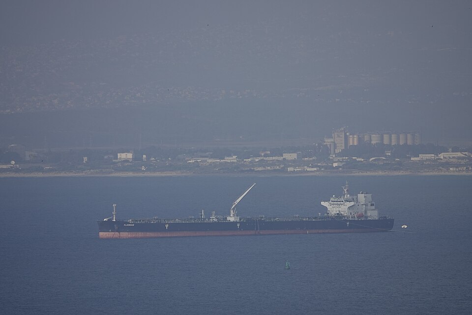 Oil tanker ship anchored offshore near a port
