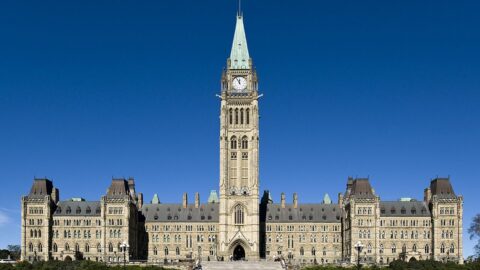 Parliament Hill in Ottawa with the Peace Tower against a blue sky