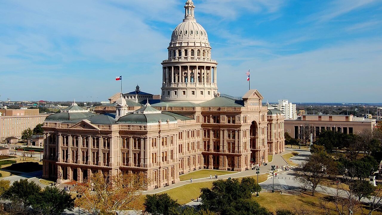The Texas State Capitol building in Austin under a clear sky