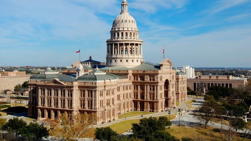 The Texas State Capitol building in Austin under a clear sky
